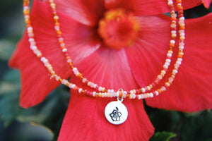 Hand stamped hibiscus seed beaded charm anklet